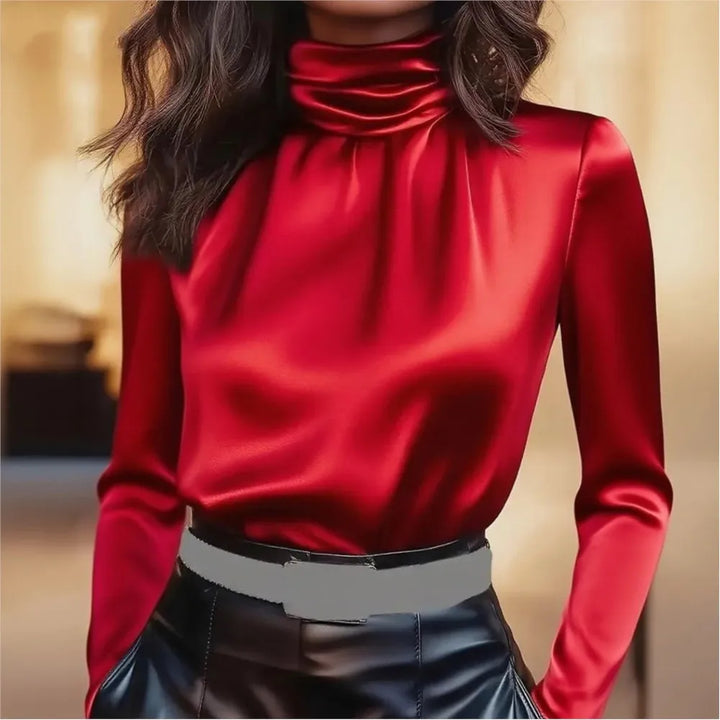 Woman wearing red satin turtleneck blouse, front view