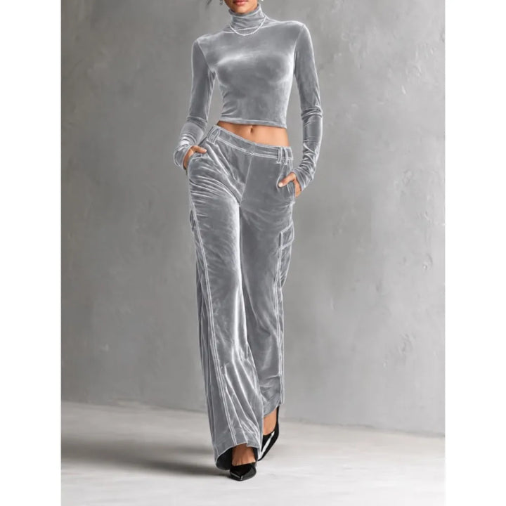 Woman wearing light grey velvet cropped turtleneck and wide leg cargo pants set