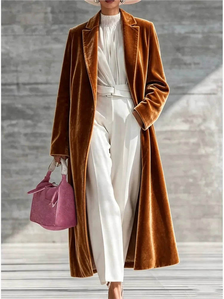 Woman wearing a brown velvet maxi coat with notched lapel