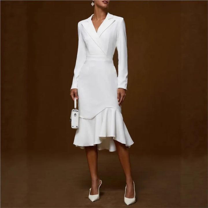 White mermaid dress with ruffled hem on model