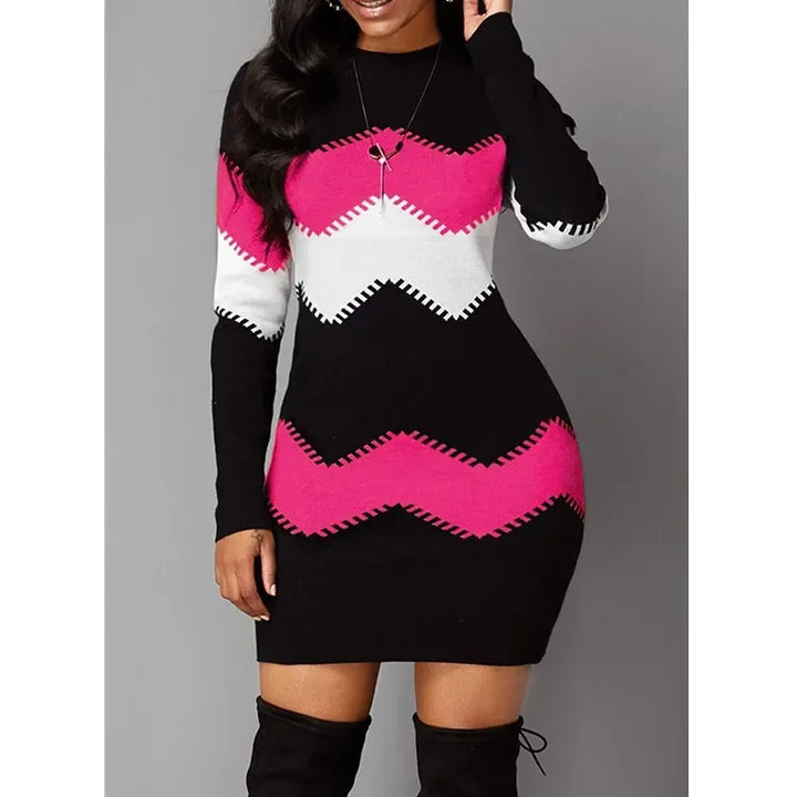 Black sweater dress with pink and white chevron stripes, front view close up