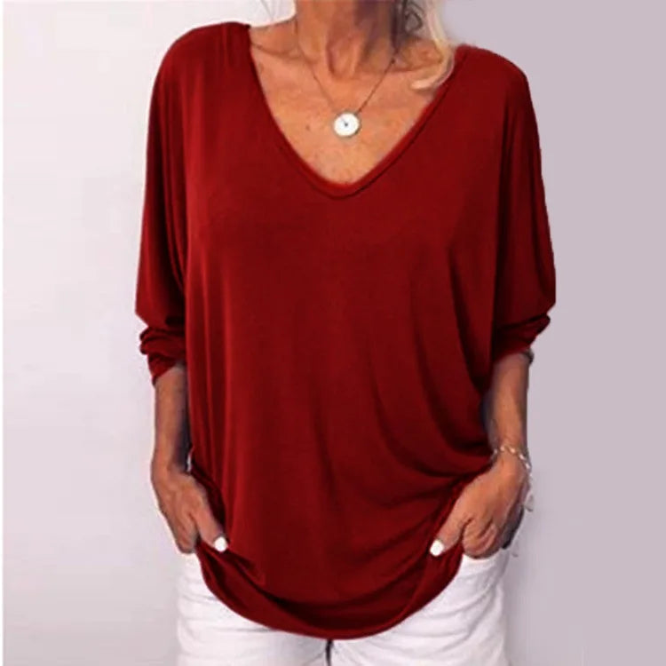 Woman wearing wine red V-neck three-quarter sleeve top, front view