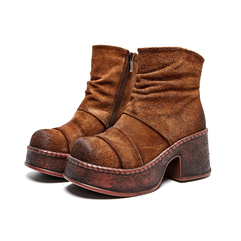 Pair of brown suede-look platform ankle boots angled view