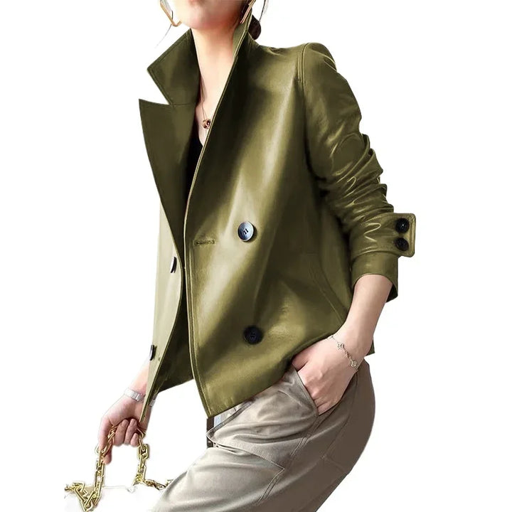 Model wearing green faux leather cropped jacket, front angled view