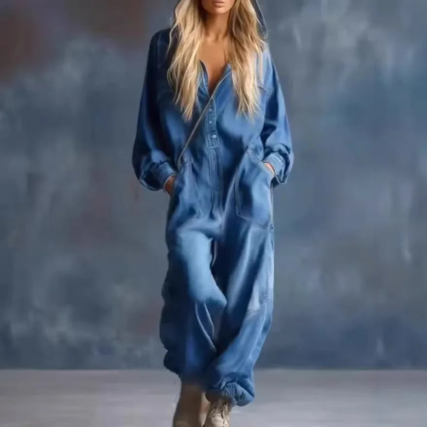 Blue denim hooded jumpsuit, front closeup with pockets