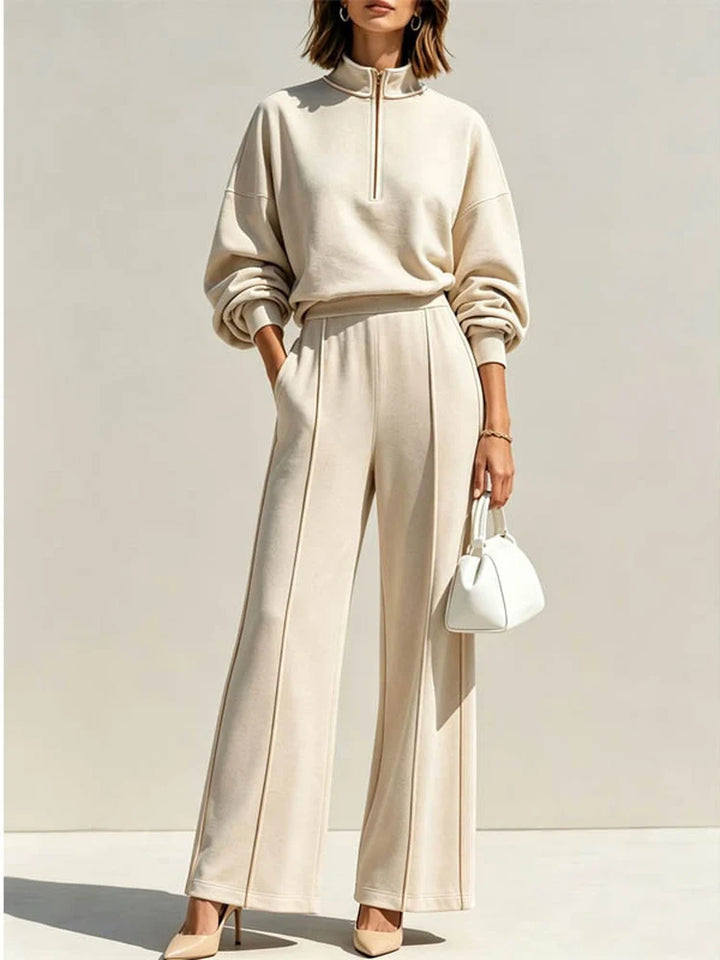 Woman wearing beige quarter zip pullover and wide leg pant set, front view