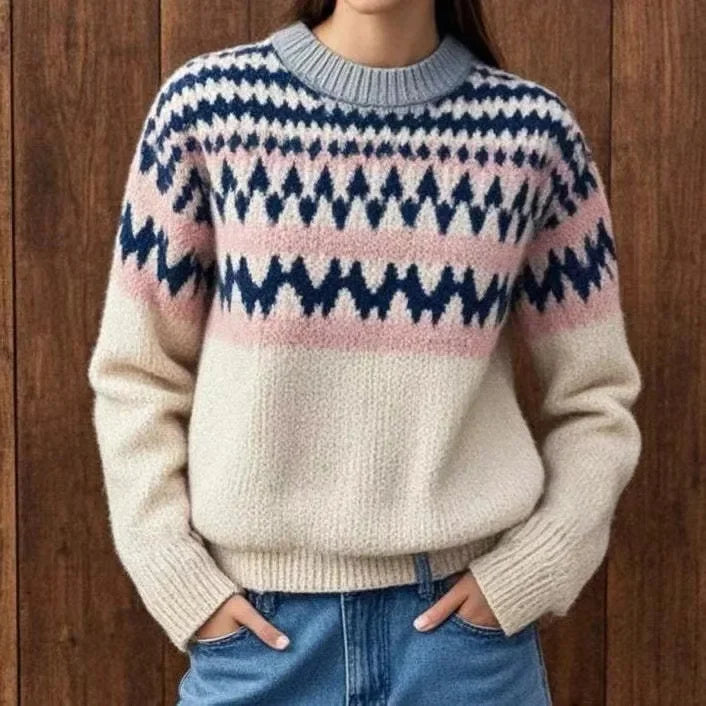Woman wearing cream fair isle sweater with navy and pink pattern