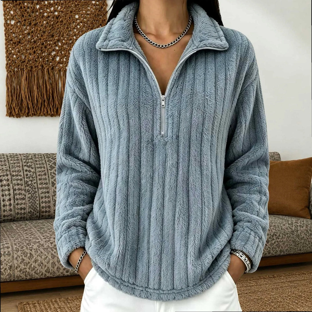 Woman wearing gray-blue ribbed quarter-zip pullover