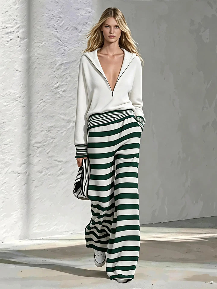 Cream half-zip hoodie with green and white striped wide leg pants, front view