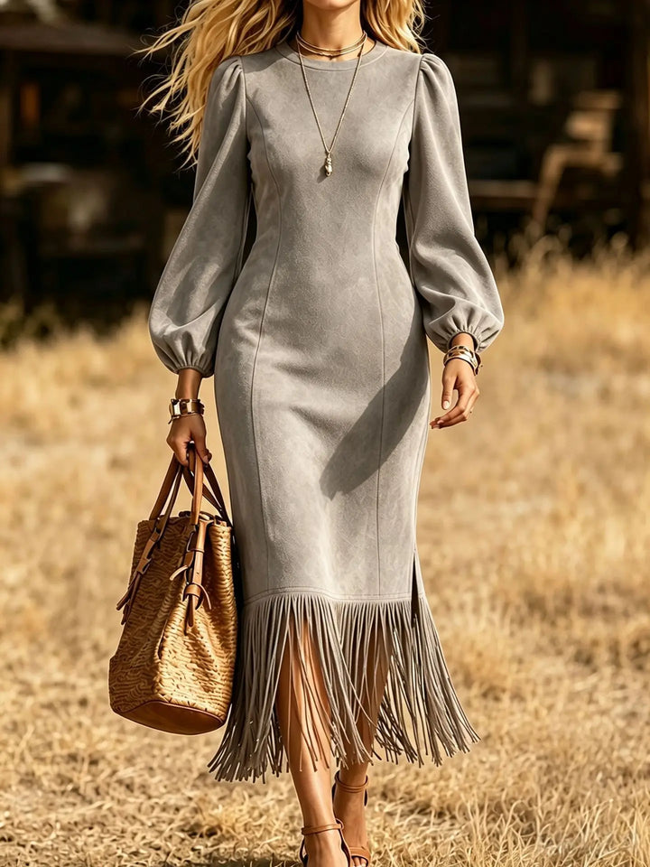 Light grey faux suede fringe hem midi dress close up with lantern sleeves