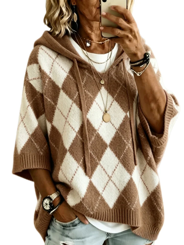 Woman wearing brown argyle hooded knit sweater, front view