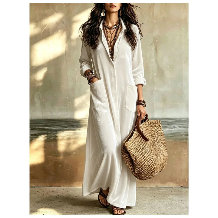 Woman wearing white velvet button front maxi dress with patch pockets