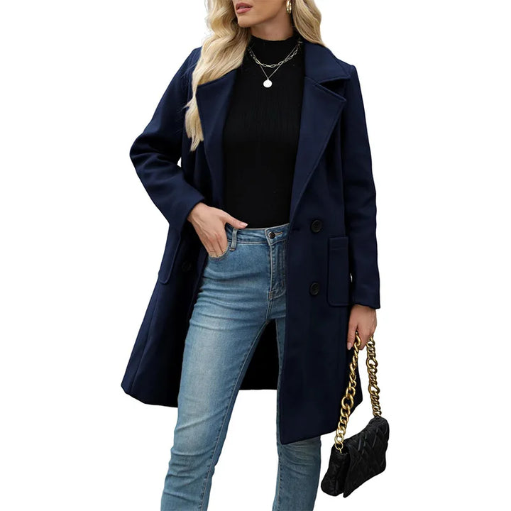 Woman wearing navy blue double breasted wool coat