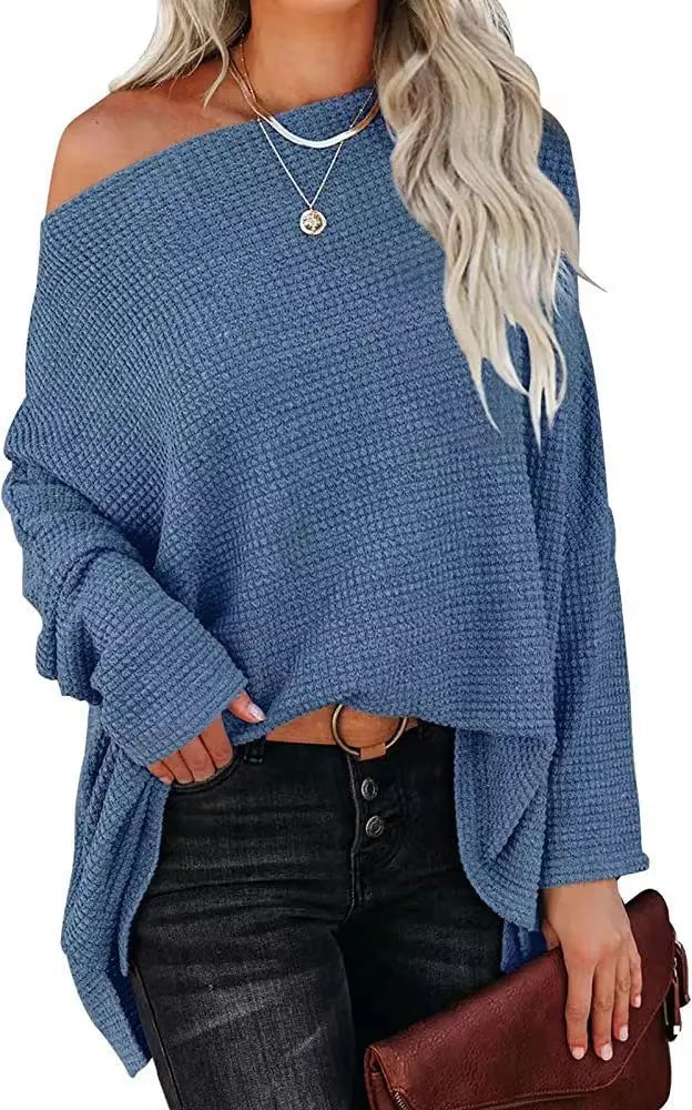 Blue waffle knit off-shoulder sweater on model
