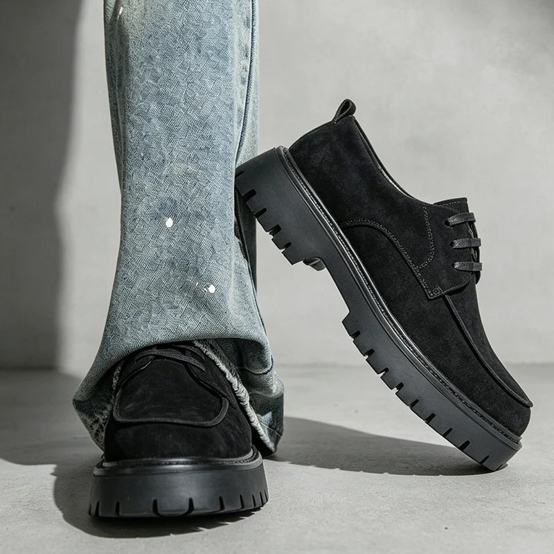 Man wearing black suede platform oxford shoes crossed stance