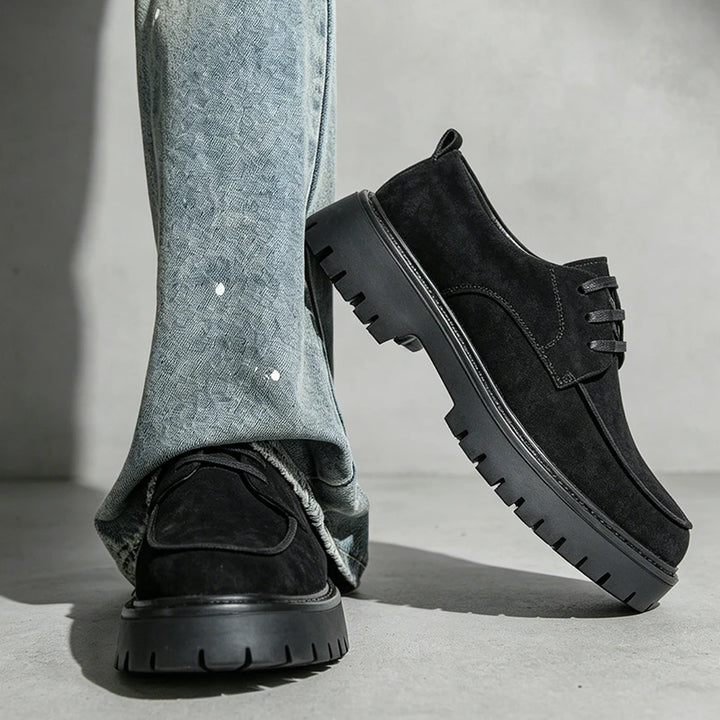 Man wearing black suede platform oxford shoes crossed stance