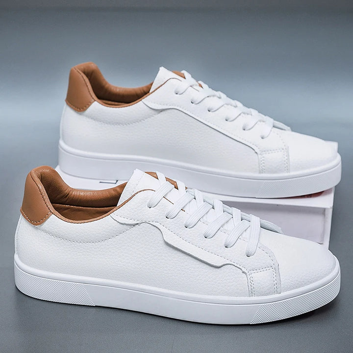 White leather-look low-top sneakers with contrast heel tab, side view