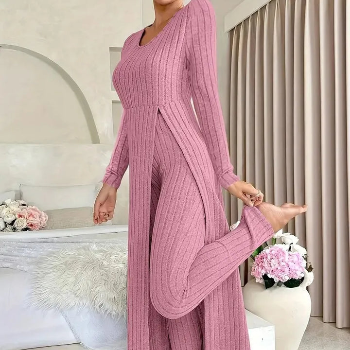 Woman wearing rose pink ribbed long slit two piece loungewear set