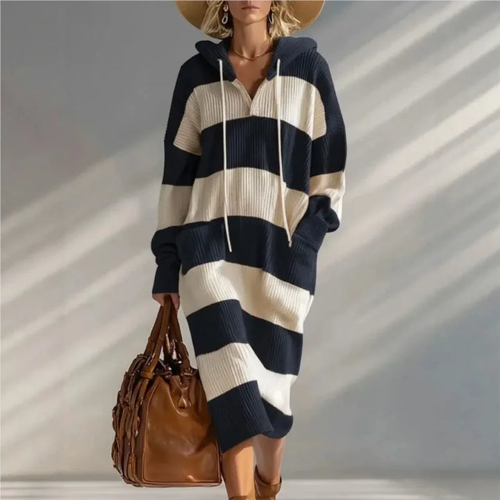 Woman wearing black and cream striped hooded sweater dress