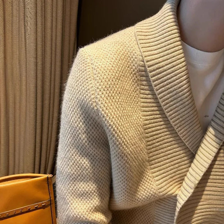 Close up of khaki cardigan waffle knit texture and shawl collar