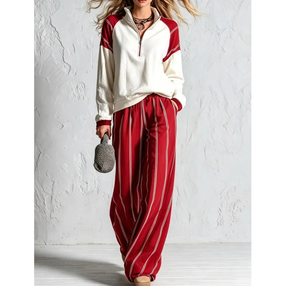 Woman wearing red striped wide leg pants with color block quarter zip pullover