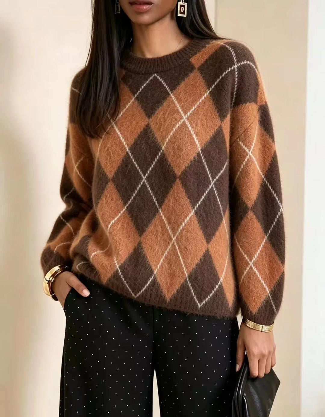 Woman wearing orange and brown argyle knit sweater
