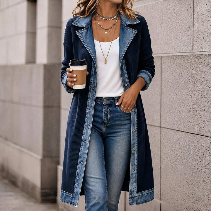 Woman wearing navy ribbed knit long cardigan coat with denim collar