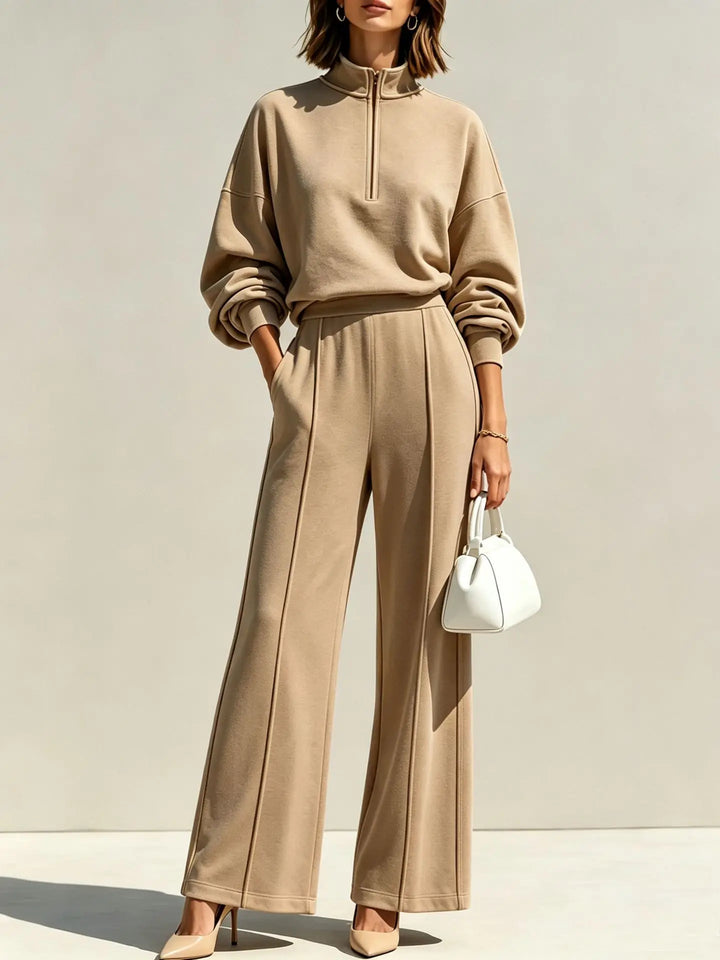 Woman wearing khaki quarter zip pullover and wide leg pant set