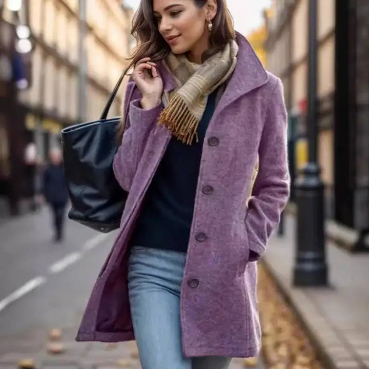 Woman wearing purple wool mid-length coat with scarf