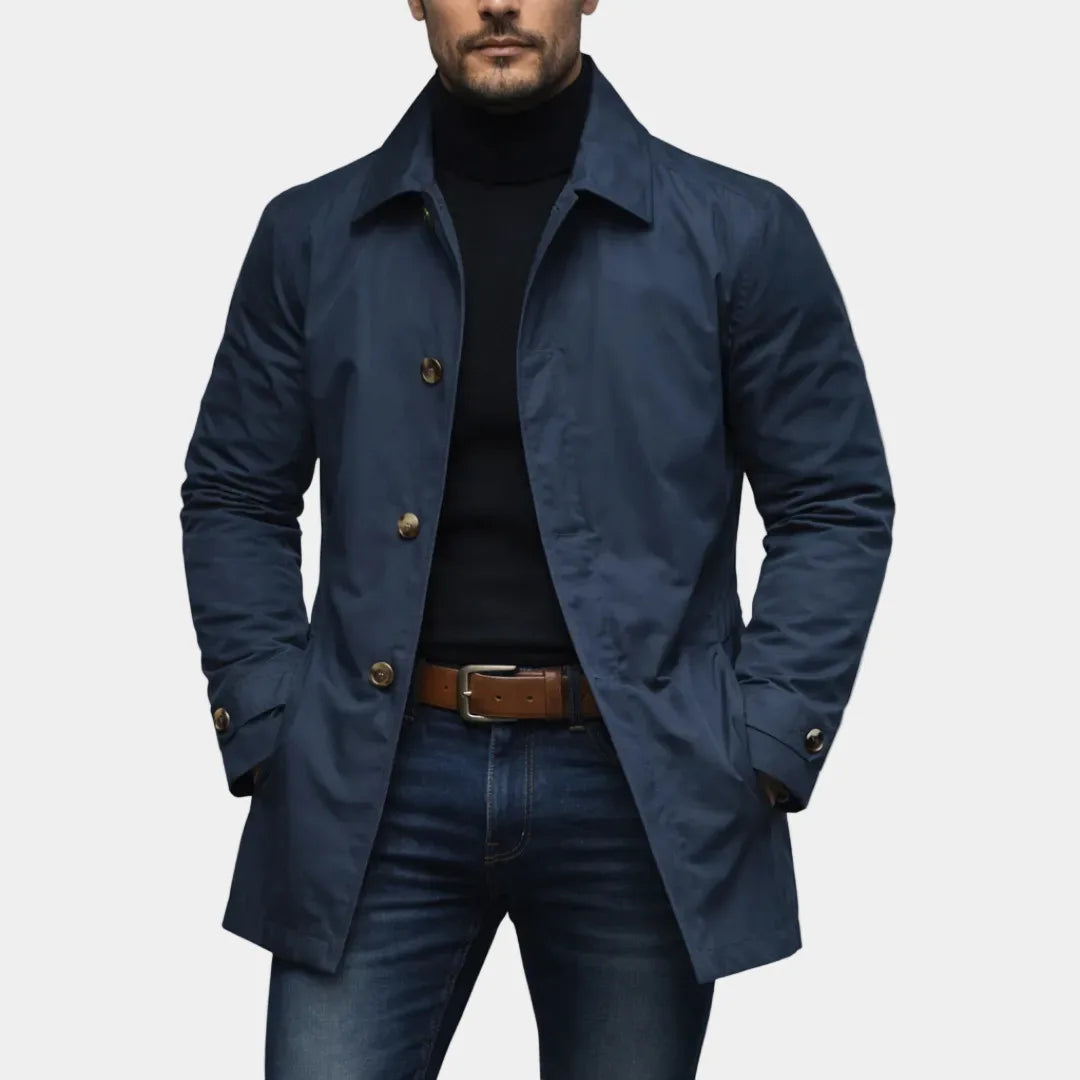 Navy trench coat buttoned front view with side welt pockets