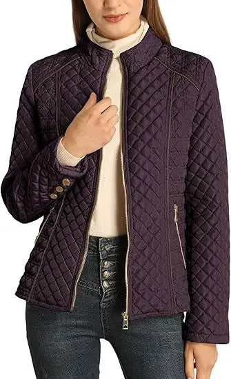 Woman wearing burgundy quilted puffer jacket close up