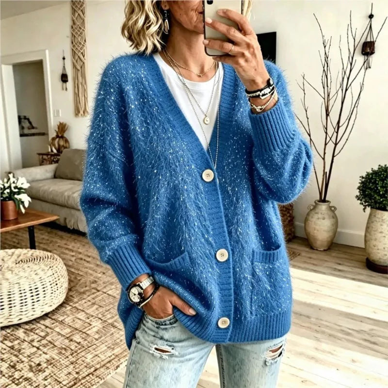 Woman wearing blue sequin eyelash-knit cardigan with pockets