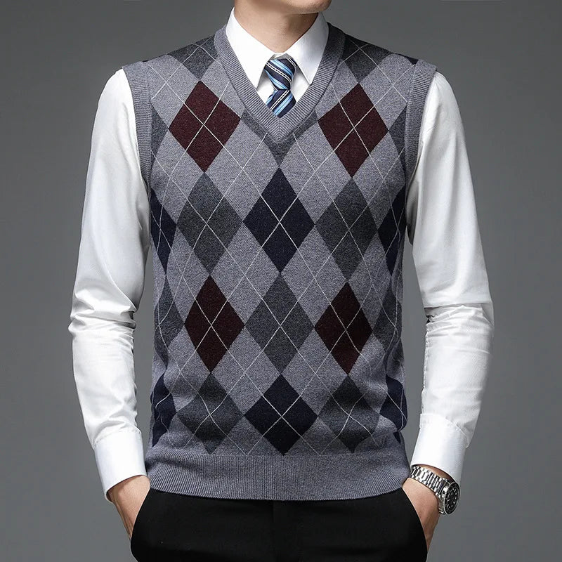 Man wearing medium gray argyle sweater vest with burgundy accents
