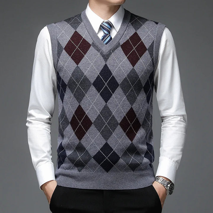 Man wearing medium gray argyle sweater vest with burgundy accents