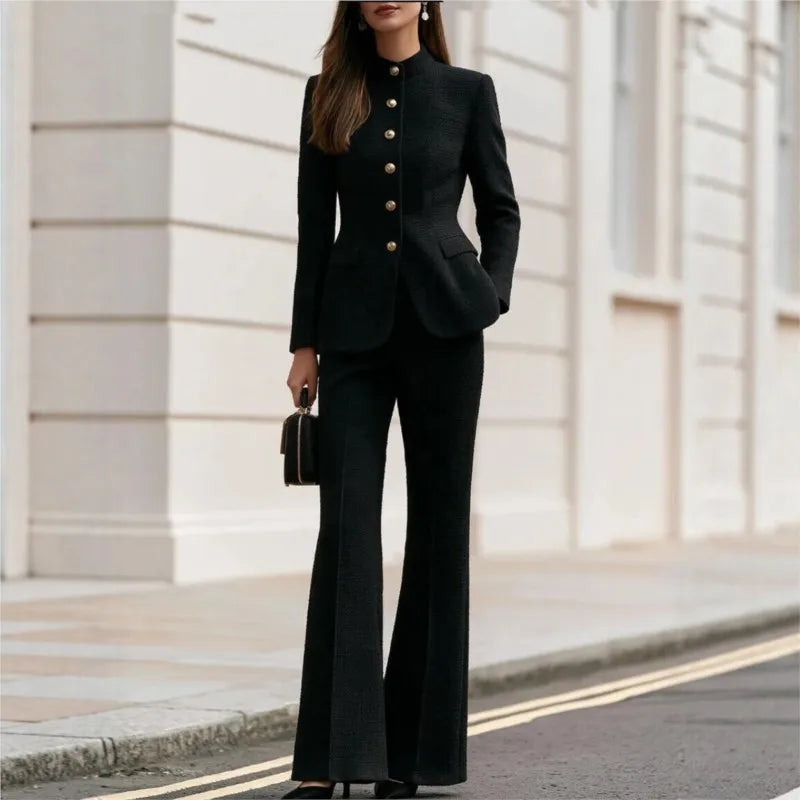Woman wearing black tweed stand collar blazer and flared trousers set