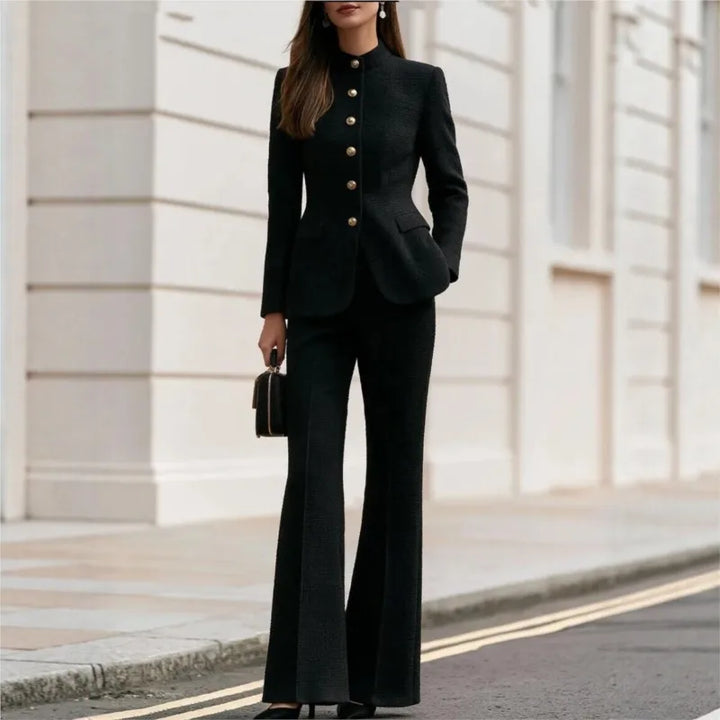 Woman wearing black tweed stand collar blazer and flared trousers set