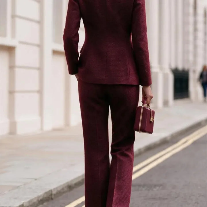 Back view of claret tweed blazer and flared trousers set