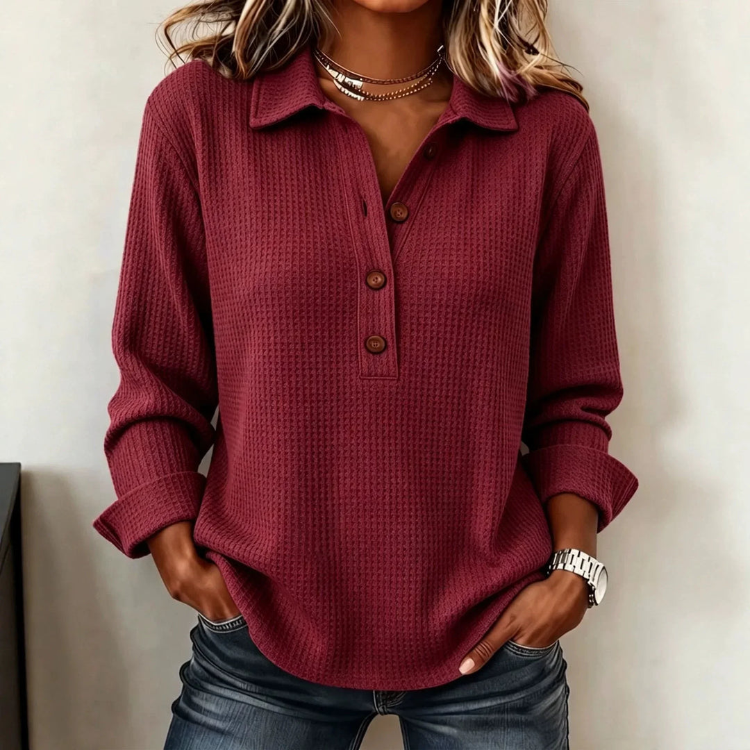 Woman wearing wine red waffle knit button placket top