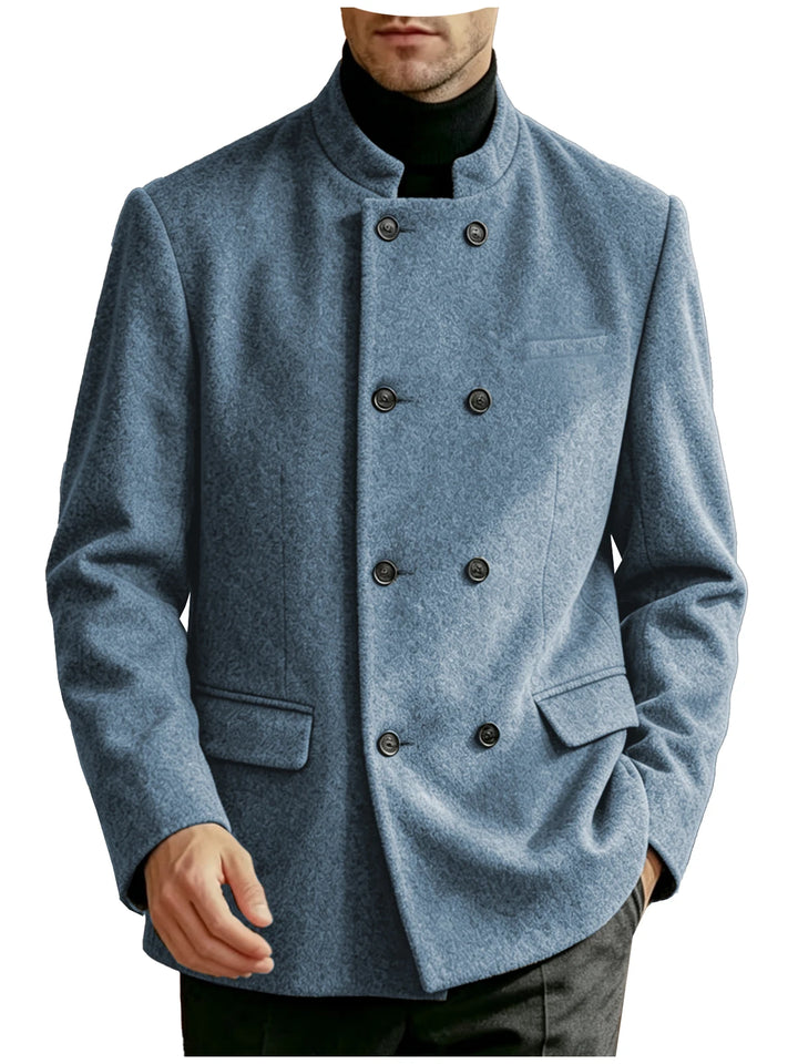 Man wearing blue mandarin collar double-breasted coat