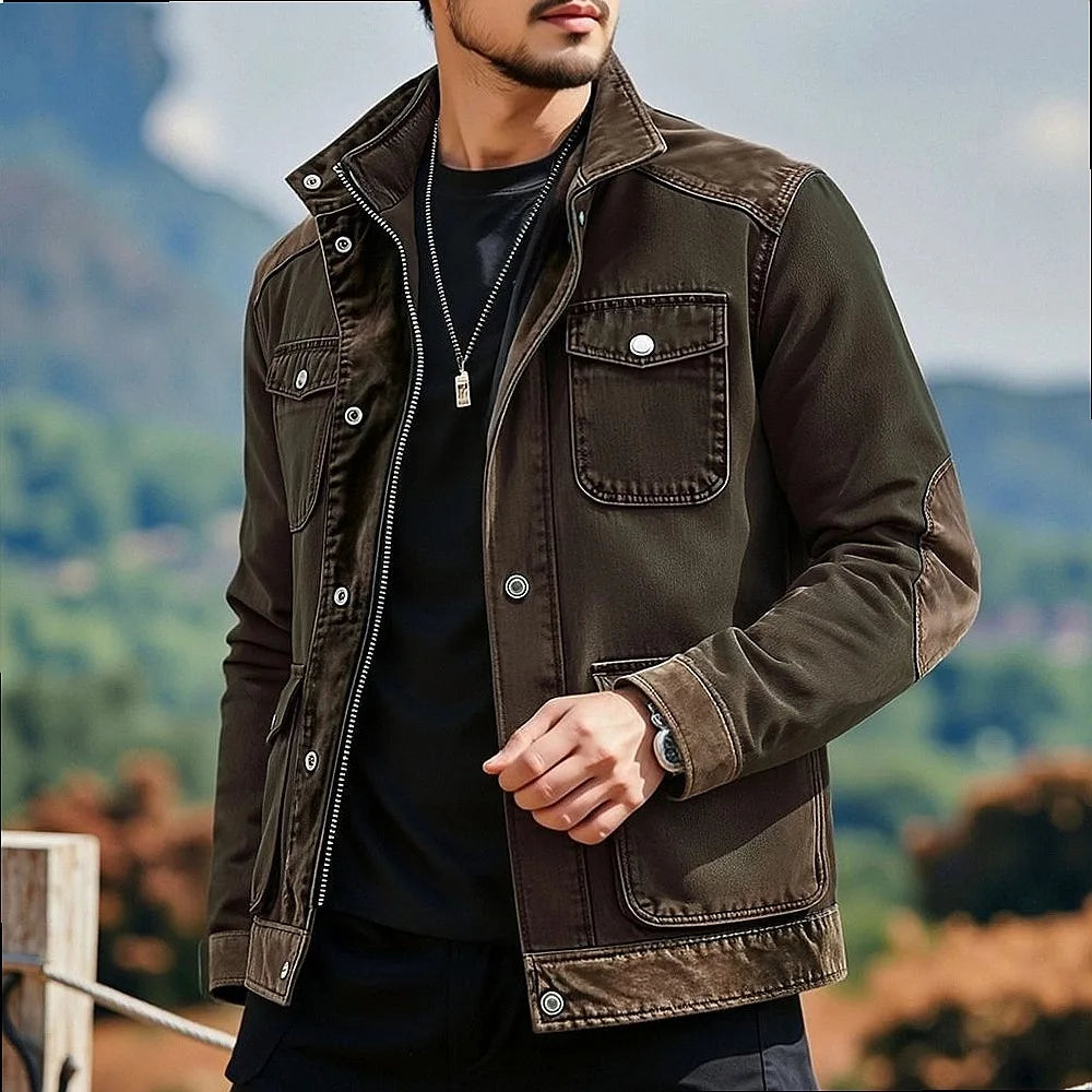 Man wearing dark brown contrast panel denim jacket, front view