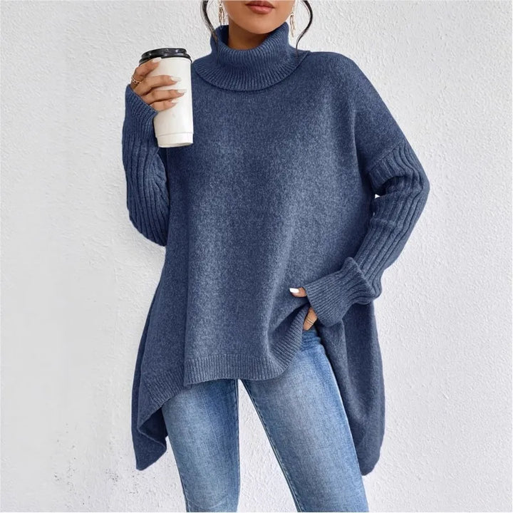 Woman wearing navy blue oversized turtleneck sweater, front view