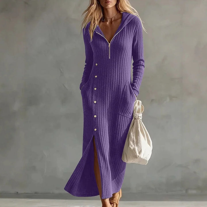 Woman wearing purple hooded ribbed knit maxi dress with half zip and side pocket