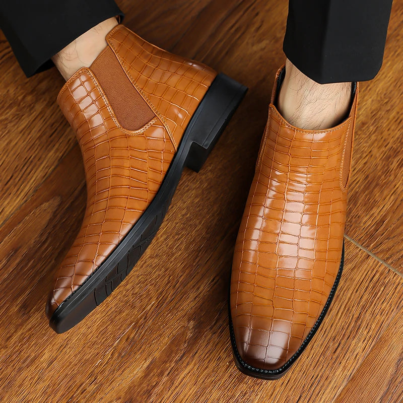 Brown Chelsea boots worn on feet, top down view
