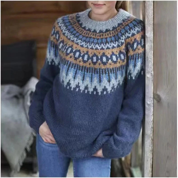 Woman wearing navy fair isle sweater with tan pattern detail
