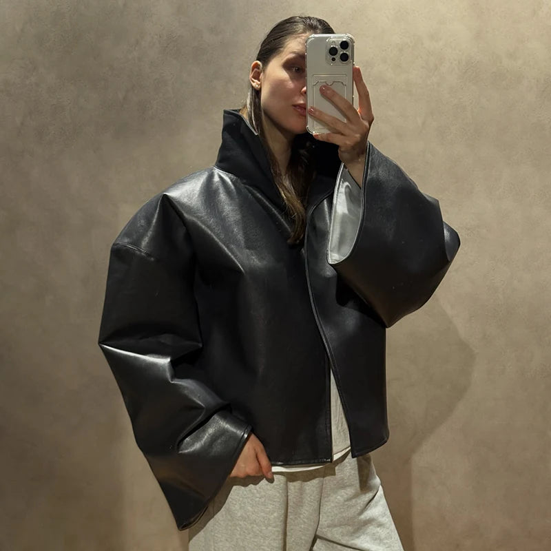 Black faux leather jacket with stand collar and wide sleeves