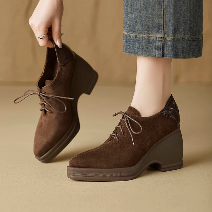 Brown suede wedge pumps shown on and off foot