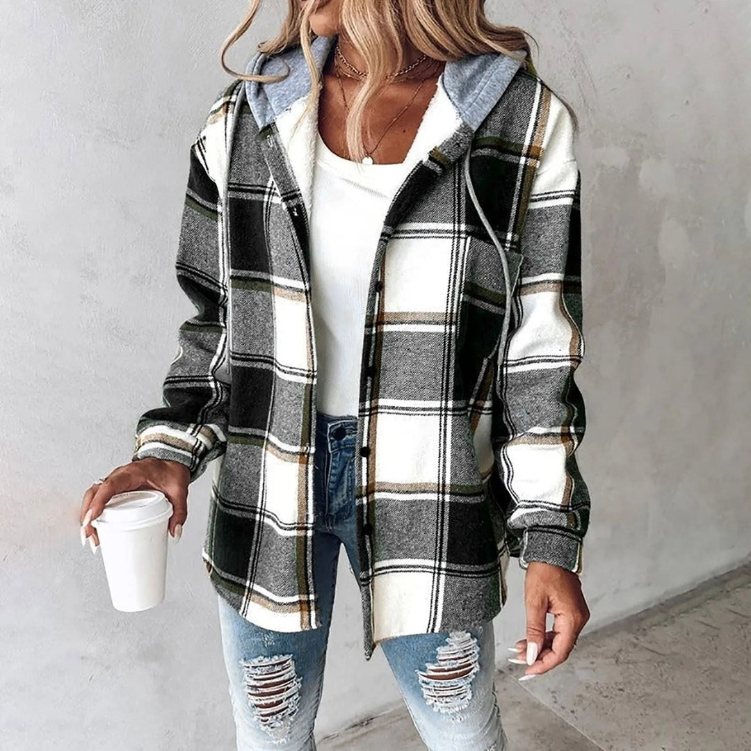 Woman wearing green and white plaid flannel shacket with gray hood, open front view