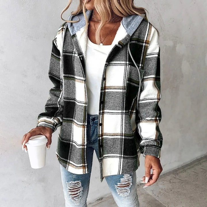 Woman wearing green and white plaid flannel shacket with gray hood, open front view