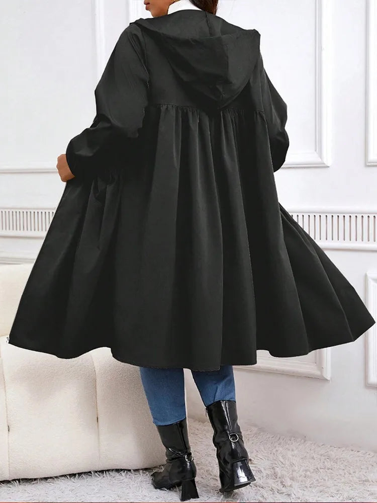 Black hooded long coat, back view showing flared hem