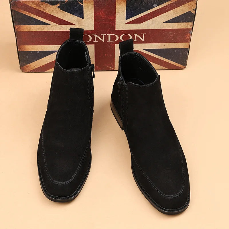 Pair of black suede Chelsea boots front view